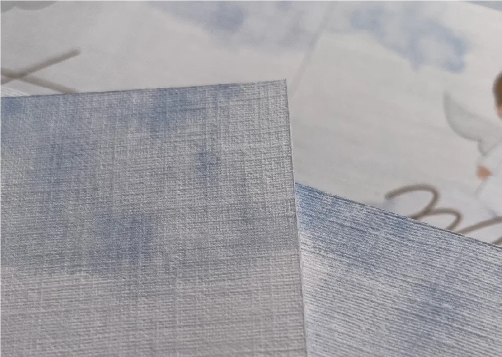 Detalhe das texturas dos papéis usados no convite do Batizado de Mateus.